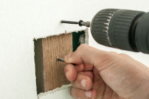 Attaching the backing support to the wall